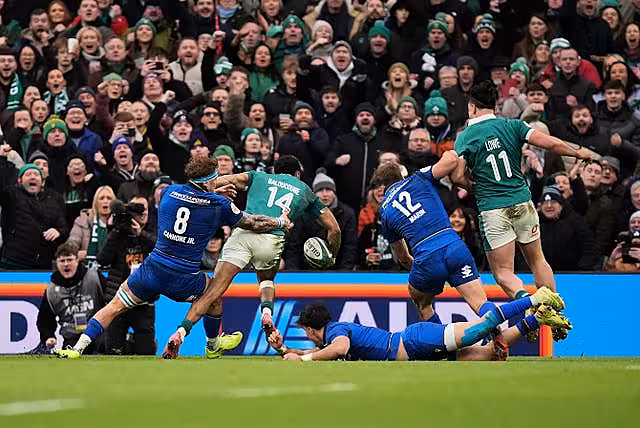Robert Baloucoune, second left, scores Ireland’s decisive third try against Italy