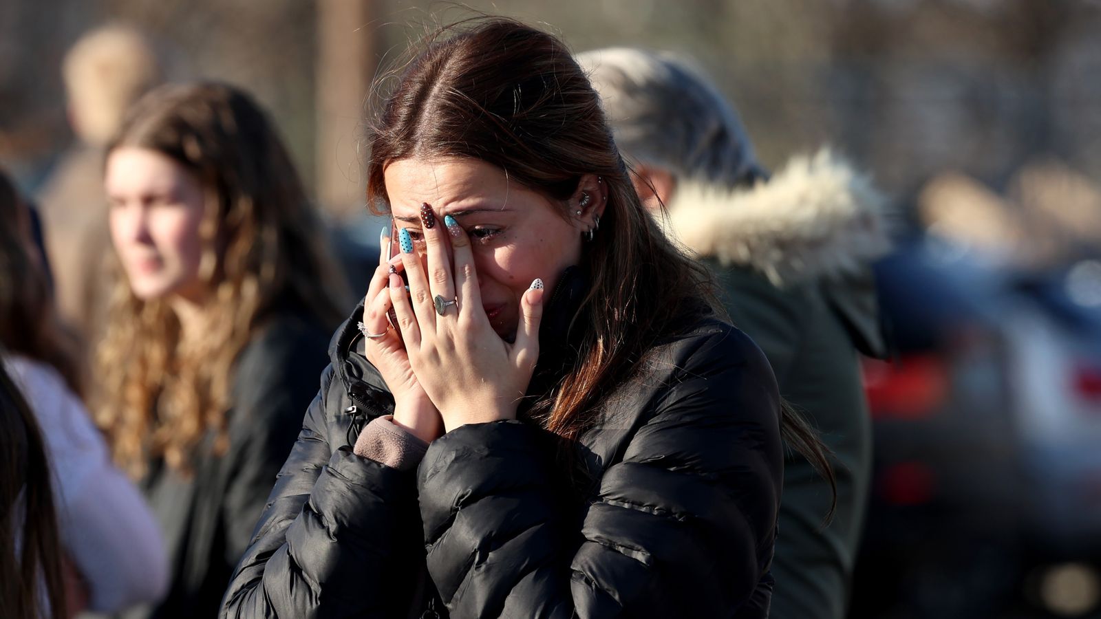 A woman reacts near the Lynch Arena in Pawtucket after a shooting at the ice rink. Pic: AP