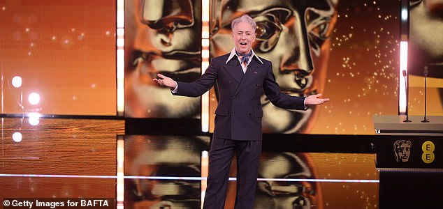 LONDON, ENGLAND - FEBRUARY 22: Host Alan Cumming speaks on stage during the EE BAFTA Film Awards 2026 at The Royal Festival Hall on February 22, 2026 in London, England. (Photo by Stuart Wilson/BAFTA/Getty Images for BAFTA)