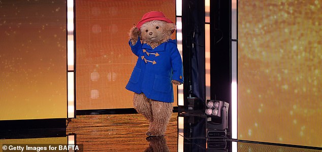 LONDON, ENGLAND - FEBRUARY 22: Paddington Bear presents the Children's & Family Film Award on stage during the EE BAFTA Film Awards 2026 at The Royal Festival Hall on February 22, 2026 in London, England. (Photo by Stuart Wilson/BAFTA/Getty Images for BAFTA)