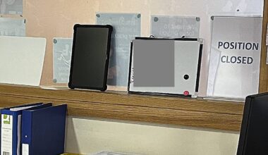 Whiteboard showing confidential information (obscured)