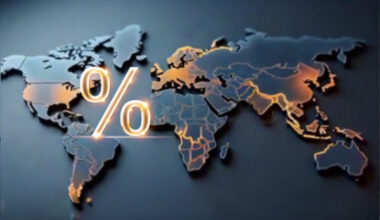 Illustration of a flat world map with a percent sign between north america continent and europe/africa continents. Colored in dark blue and golds.