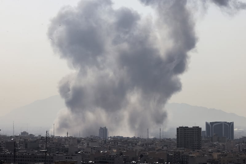 A plume of smoke rises following a reported explosion in Tehran on Saturday. Photograph:  Atta Kenare/AFP via Getty Images