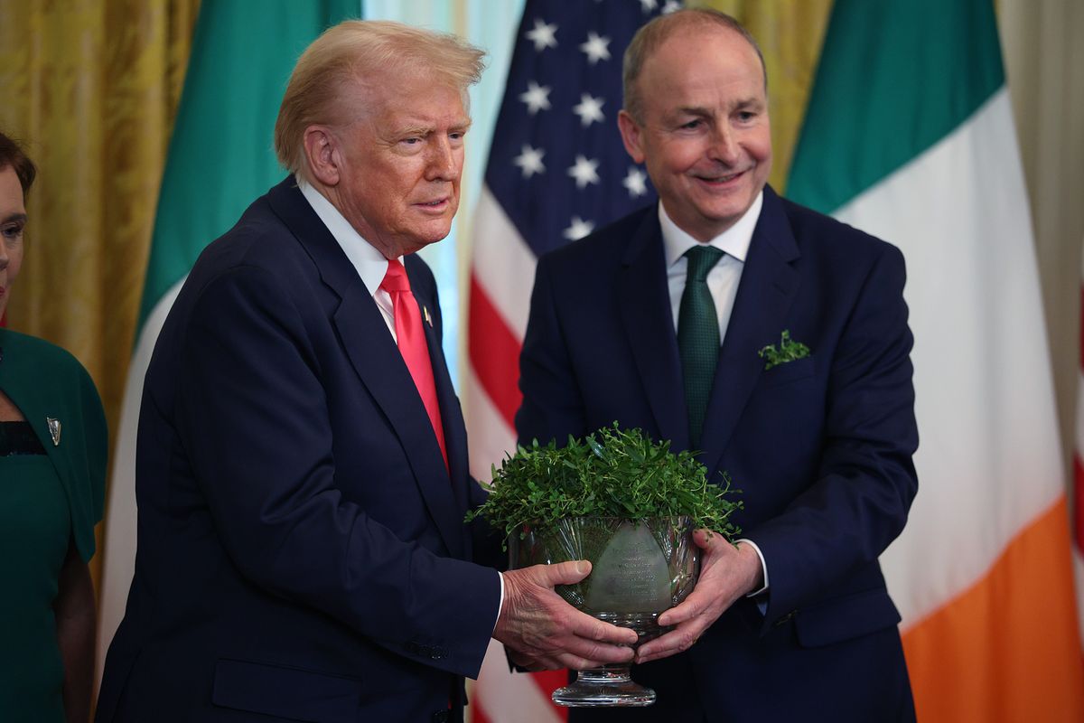 Micheál Martin presents U.S President Donald Trump with a bowl of clover during a St. Patrick’s Day event on March 12, 2025 in Washington, DC