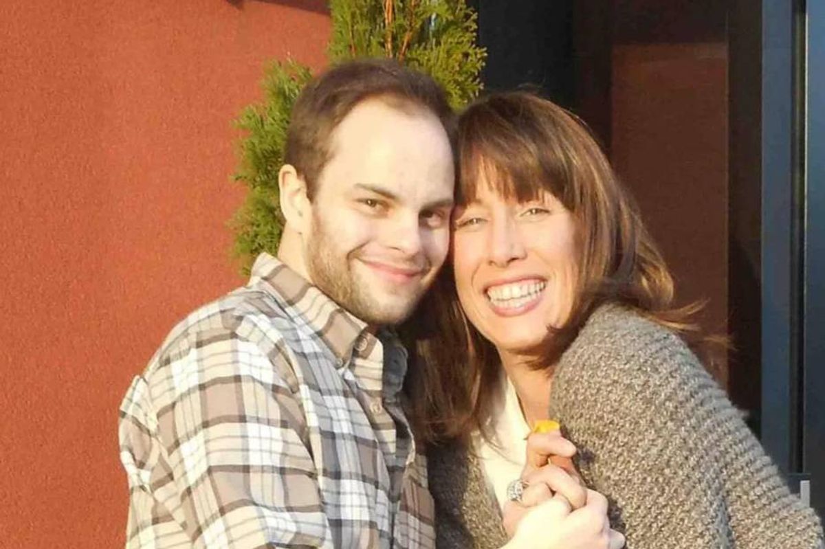 Ben cuddling his mother, Kim