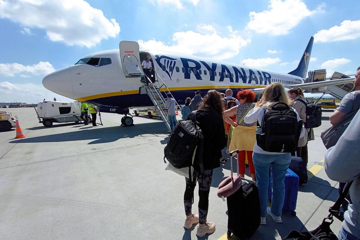 Passengers queuing to board a Ryanair flight