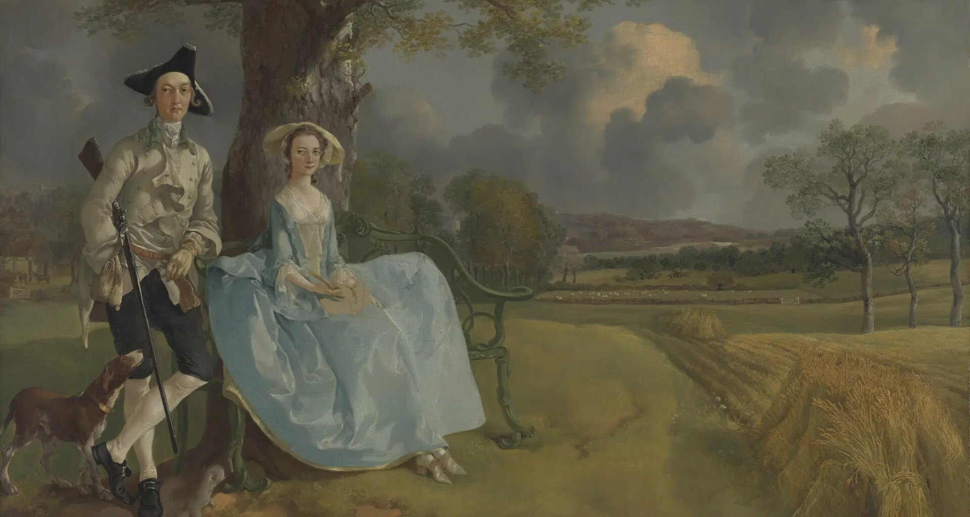 A couple in 18th-century attire sit under a tree with a dog, overlooking a countryside landscape with rolling hills and wheat fields.