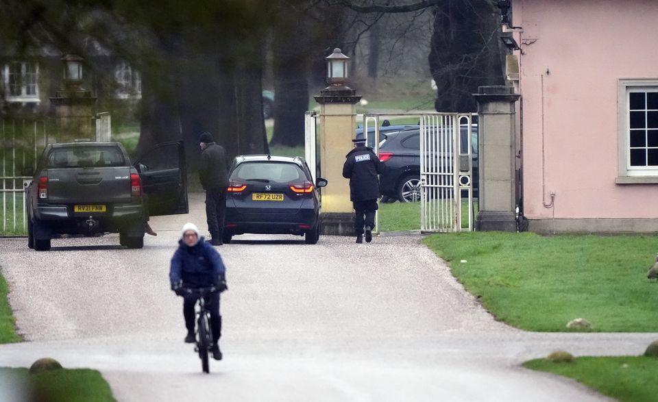 A police officer at the gates at Andrew Mountbatten-Windsor’s former home in Windsor (Jonathan Brady/PA)