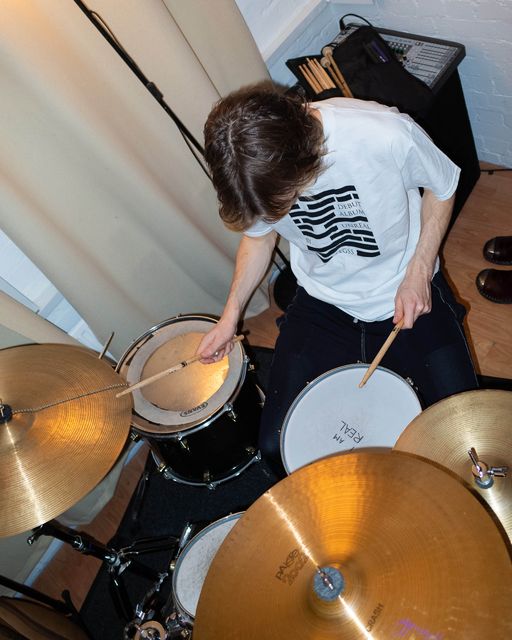 A member of the band playing drums with cymbals similar to those reported stolen. Pic: Legss