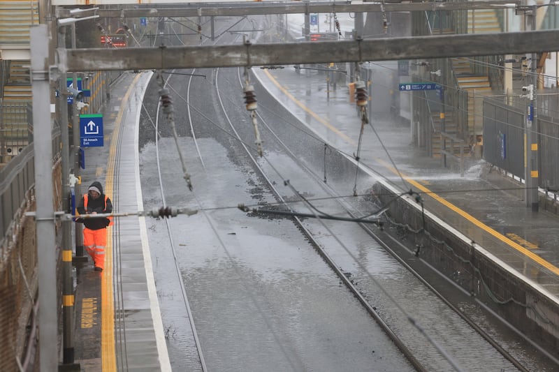 Waves crash over Blackrock dart station.