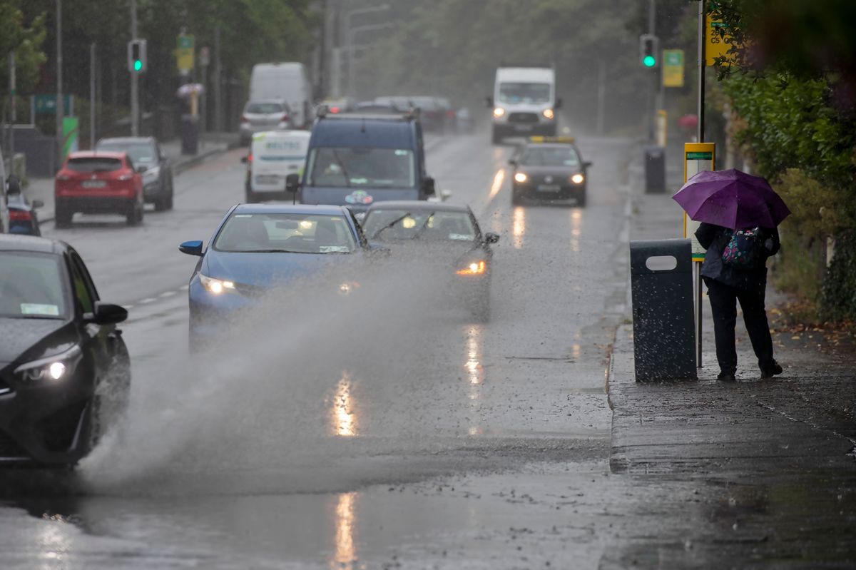 14/07/2023 - A vehicle drives through a flood on Conyngham Road, Dublin