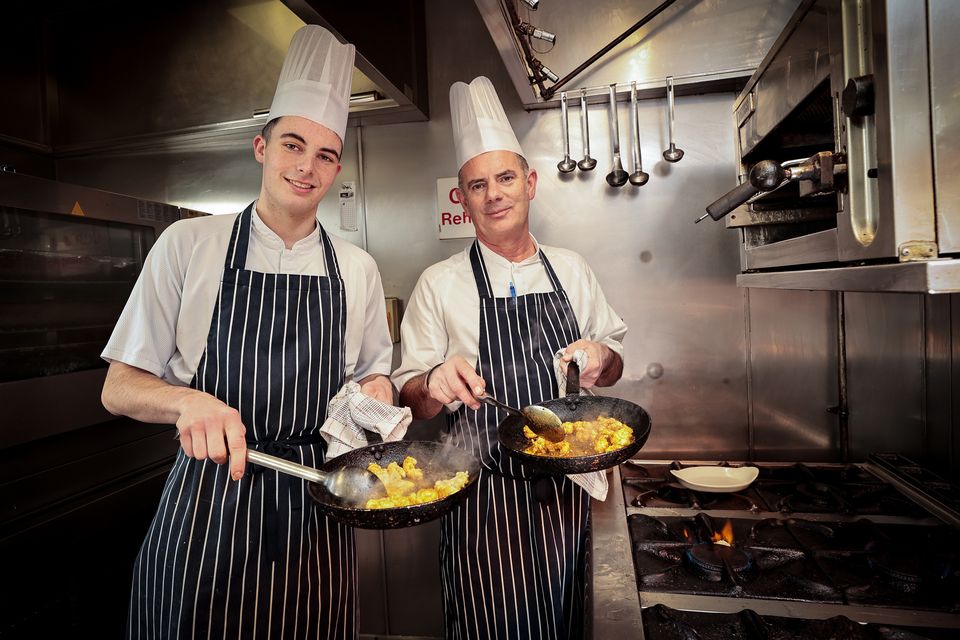 Chef de cuisine and director of Roly's Bistro Paul Cartwright and his son Conor in the Dublin restaurant's kitchen. Photo: Gerry Mooney