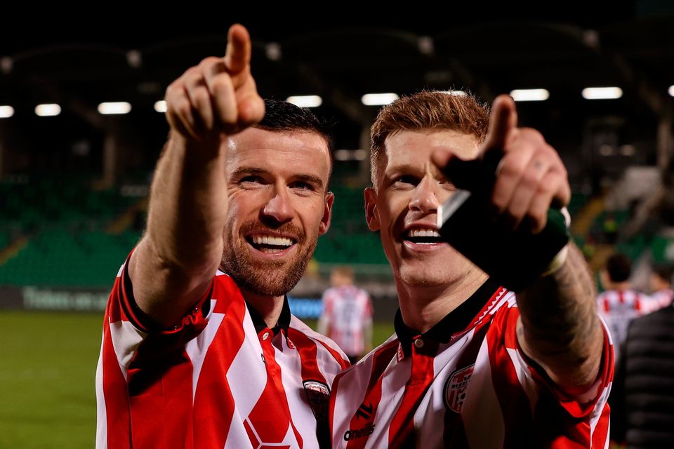 Derry City players, Patrick McClean, left, and James McClean celebrate winning the President's Cup