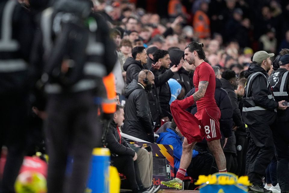 Liverpool's Dominik Szoboszlai walks down the tunnel after being sent off