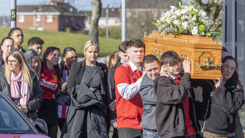 The remains of Caoimhinn Porter-McLoone is carried to St Brigid's Church by family and friends. Photo: North West Newspix