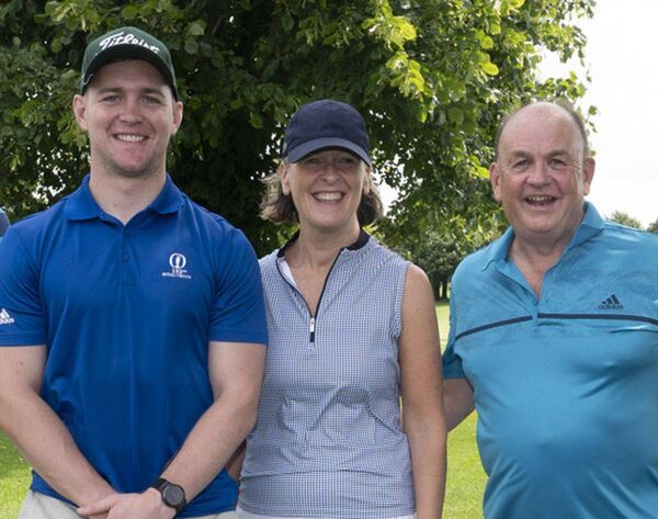 Conor Kelly pictured with his parents Niamh and Aidan at last year's Portlaoise RFC golf classic  	 Photo: Denis Byrne