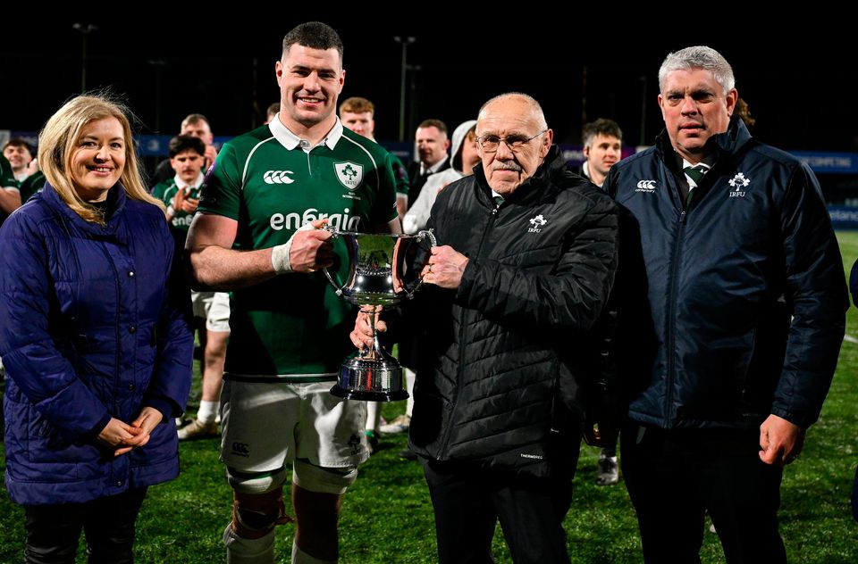 Ireland captain Jack Kelleher is presented with the Dalriada cup by, from left, Energia head of Brand Amy O'Shaughnessy, IRFU committee member John McKibbon and IRFU committee member Dave Ryan Photo: Brendan Moran/Sportsfile