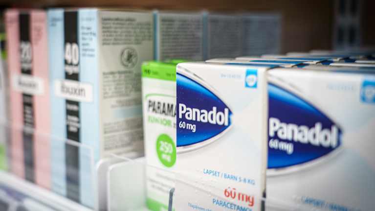 Pain medication in a pharmacy shelf.