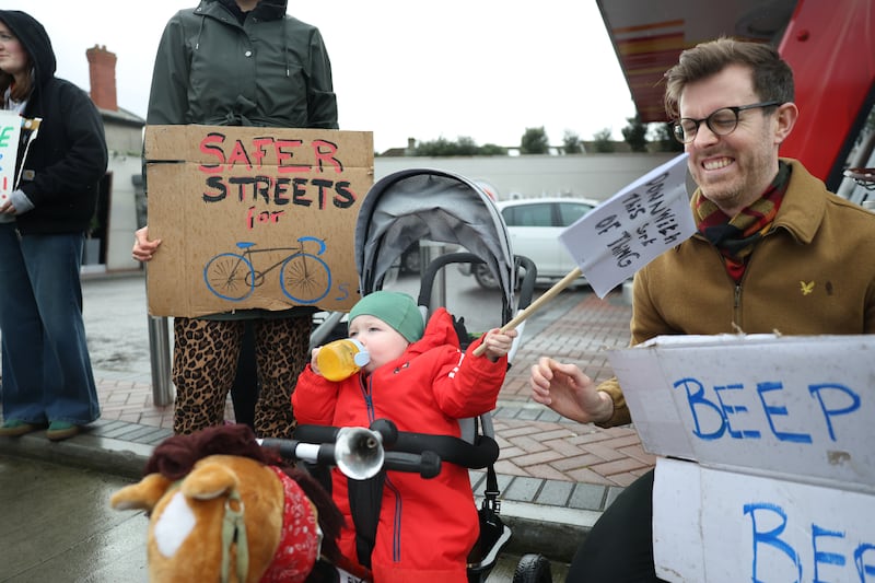 Eighteen-month-old Cuán with his family at the Connecting Cabra protest outside Go petrol station in Cabra, Dublin. Photograph: Enda O'Dowd