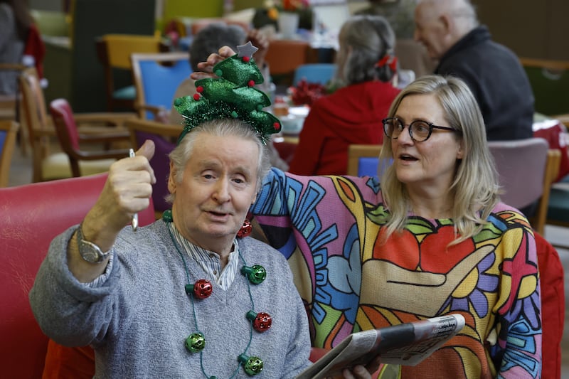 Peter Slater with volunteer Rachael Davies: 'It’s amazing how much the music means to the [residents],' says Davies. 'They all like different things, one loves Elvis, another is more into rock. Some of them love Joe Dolan.' Photograph: Nick Bradshaw/The Irish Times