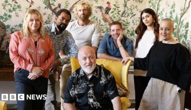 A group shot of the people featuring in a new BBC art show including Bill Bailey sat in a yellow chair and Ricky Wilson leaning on it smiling