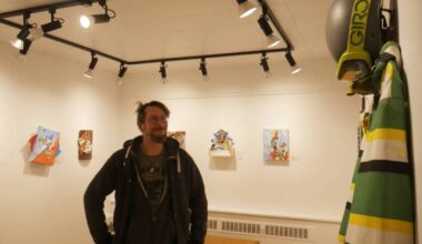 Painter Jacques Moeder admires his Story of a Crash exhibit at the Revelstoke Visual Arts Centre on Wednesday, Jan. 28. (Evert Lindquist/Revelstoke Review)