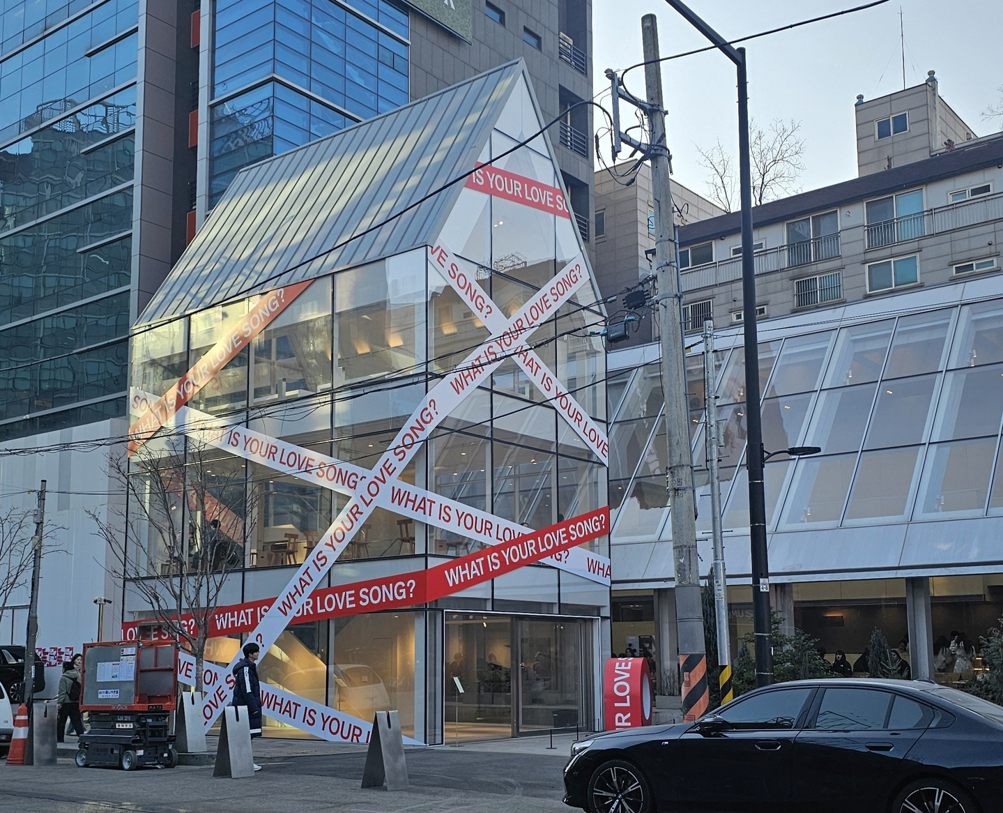 A promotional campaign for “What Is Your Love Song?,” part of BTS’s upcoming fifth full-length album, “Arirang,” is displayed outside a building in eastern Seoul on Feb. 19. [SHIN HA-NEE]