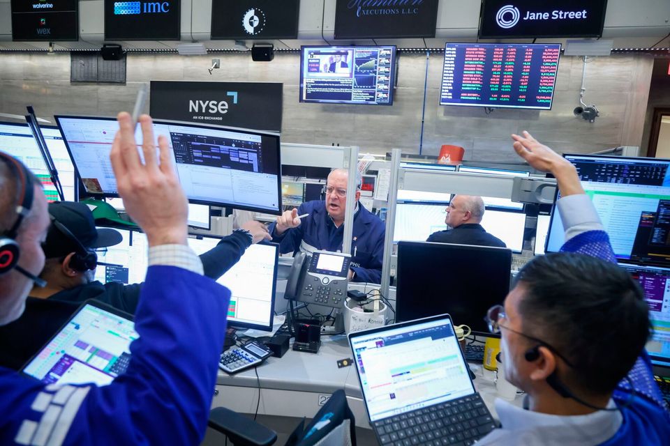 Traders work on the floor at the New York Stock Exchange yesterday. Photo: Bloomberg
