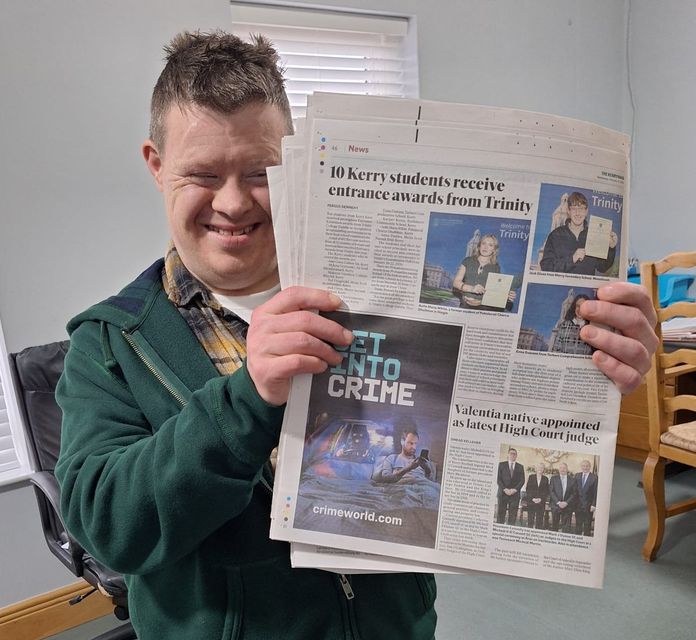 Diarmuid with the copy of The Kerryman he brought to the Áras containing an article on Micheál's appointment to the High Court.