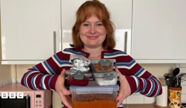 Izzie Cox holding four filled food containers and two breakfast wraps which are in foil