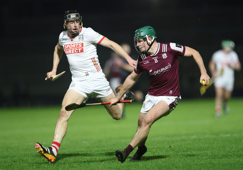 Cork’s Robert Downey closes in on Gavin Lee of Galway. Picture: Inpho/James Crombie