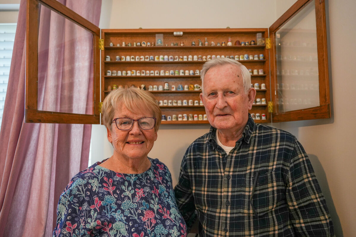 Carmel and Kevin Jones in front of the cabinet that Kevin built for Carmel's collection. Picture by Noel Sweeney