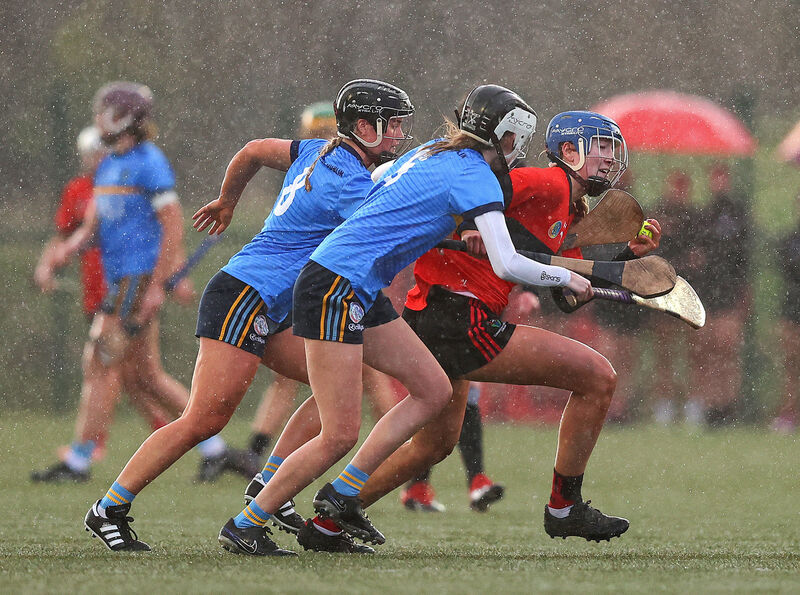 University College Cork’s Aoife Healy takes on Niamh Phelan of University College Dublin in the Ashbourne Cup final. Picture: INPHO/Tom O’Hanlon