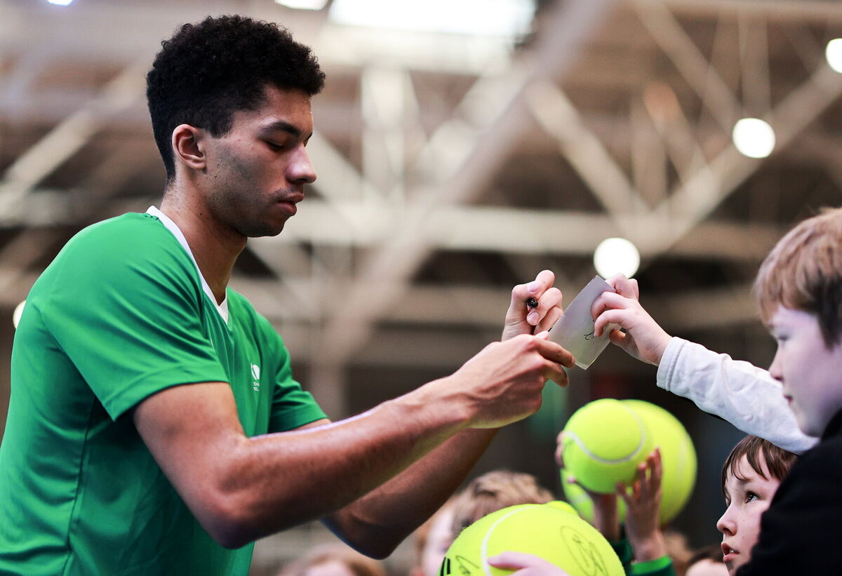 Michael Agwi of Ireland signs autographs after the singles match against Taym Alazmeh of Syria on day two of the Davis Cup World Cup Group II play-off match between Ireland and Syria at UL Arena in Limerick. Photo by Thomas Flinkow/Sportsfile