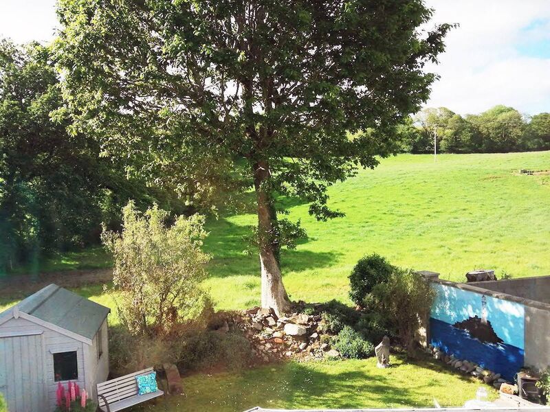 Beautiful oak tree is the garden backdrop