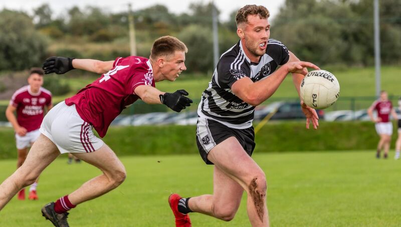 Castletownbere's Fintan Fenner moves away from Rockchapel’s Brian Carroll in 2024. Picture: Anne Marie Cronin