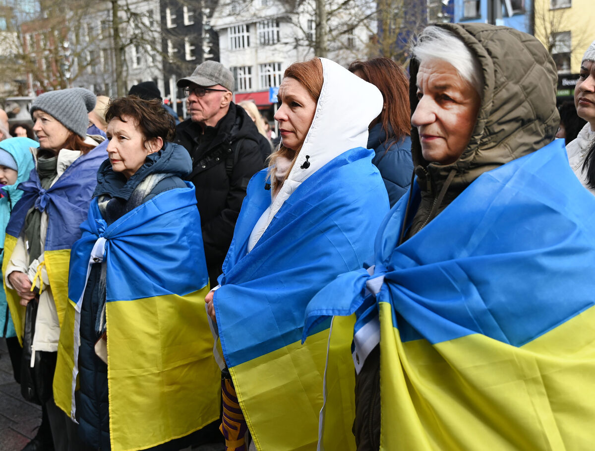  Listening to speeches at the rally in Cork in support of Ukraine to mark the fourth anniversary of Russia's invasion. Picture: Eddie O'Hare