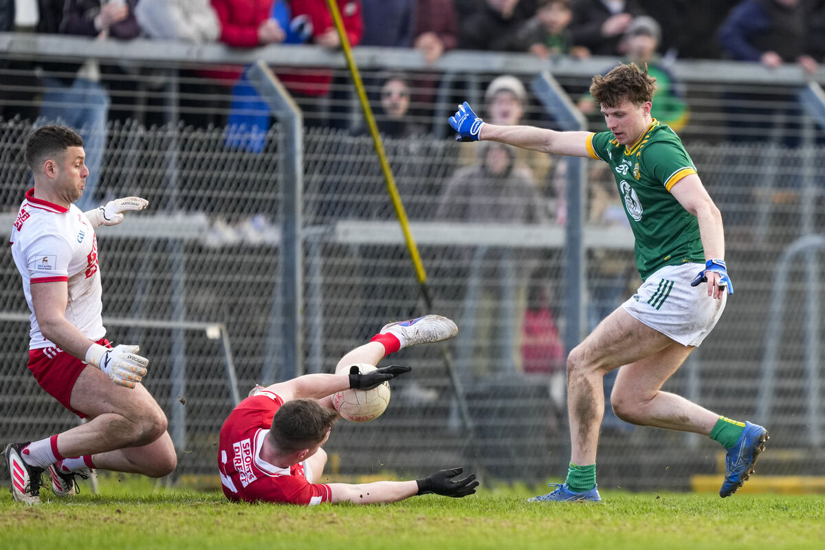 Adam O'Neill of Meath with a shot at goal blocked by Luke Fahy of Cork. Picture: INPHO/James Lawlor