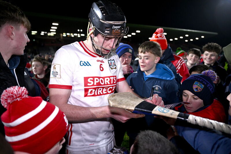 Robert Downey signs autographs after the win over Galway - he will also be absent on Sunday. Picture: Ben McShane/Sportsfile