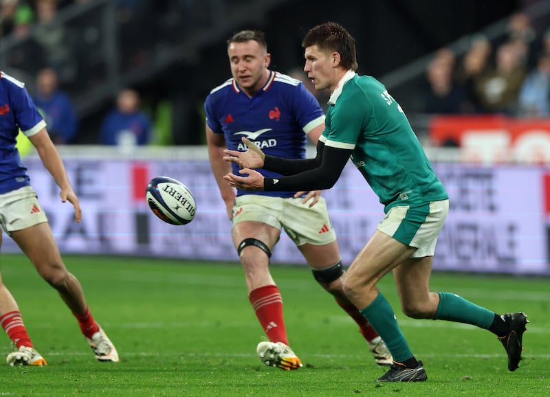 Sam Prendergast of Ireland passes the ball against France. Photograph: David Rogers/Getty