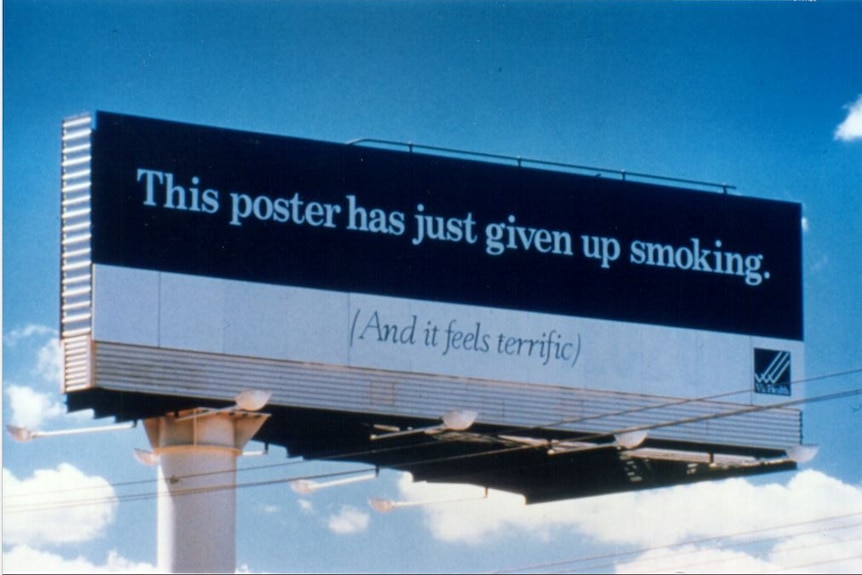 A billboard reading 'this poster has just given up smoking'