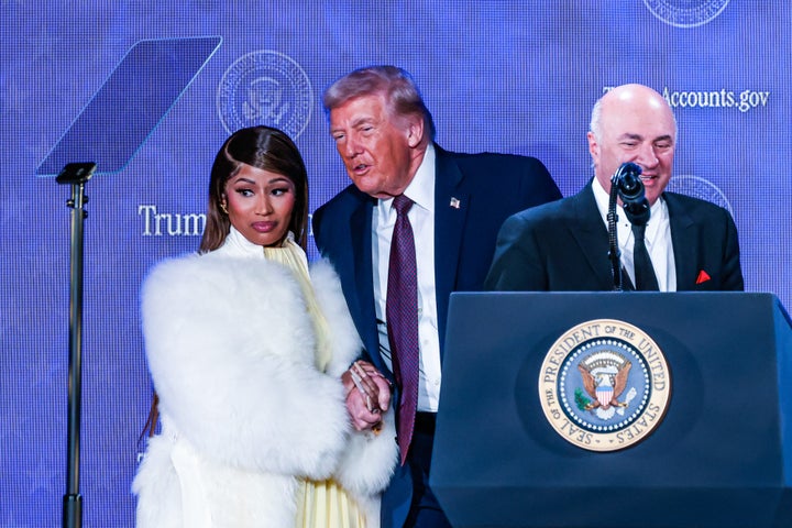 Rapper Nicki Minaj, left, holds the hand of President Donald Trump, center, as television personality Kevin O' Leary speaks during the Trump Accounts Launch Summit in Washington, D.C. in January.