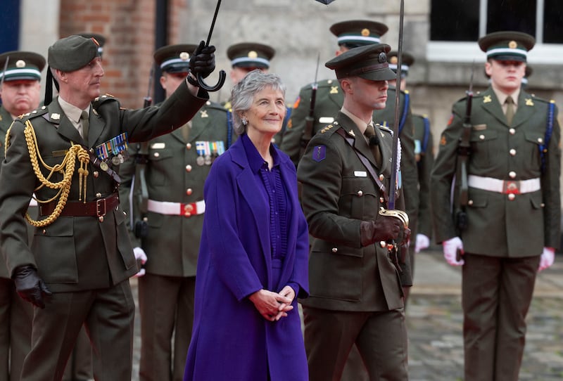 President Catherine Connolly, wearing Louise Kennedy's Maya coat, Orelia blouse and Julie trousers, inspects the Guard of Honour at Dublin Castle after her inauguration. Photograph: Sam Boal/Collins Photos  

