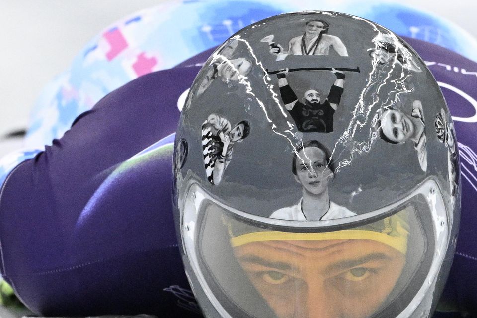 Ukraine's Vladyslav Heraskevych takes part in the skeleton men's training session at Cortina Sliding Centre yesterday.