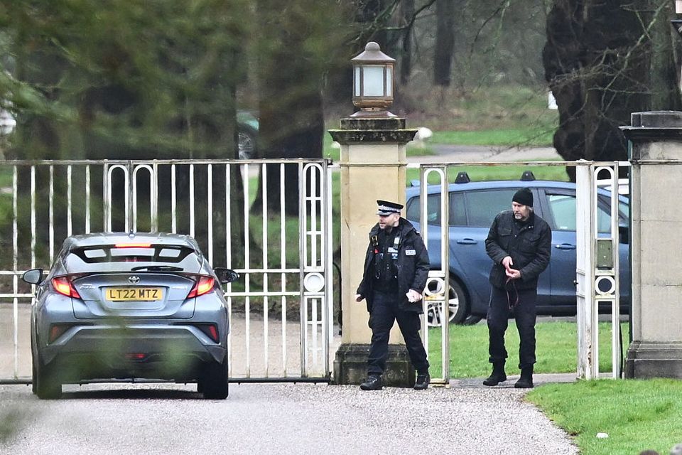 Police officers are stationed outside as pedestrians and vehicles approach the gates of the Royal Lodge, Andrew Mountbatten-Windsor's former residence in Windsor Great Park, February 19, 2026 in Windsor, England. The former Prince Andrew was arrested today at his new residence on the Sandringham estate on suspicion of misconduct in public office. Photo: Leon Neal/Getty Images
