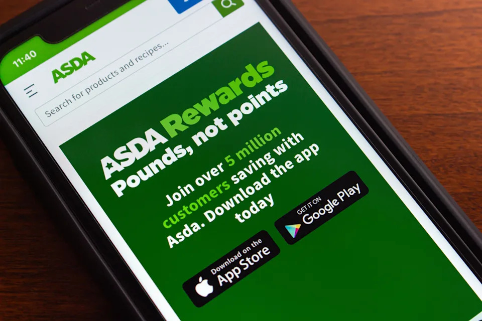 ASDA Rewards app website seen in iPhone. It is program that allows users to accumulate ASDA Pounds in cashpot, which can be converted into vouchers