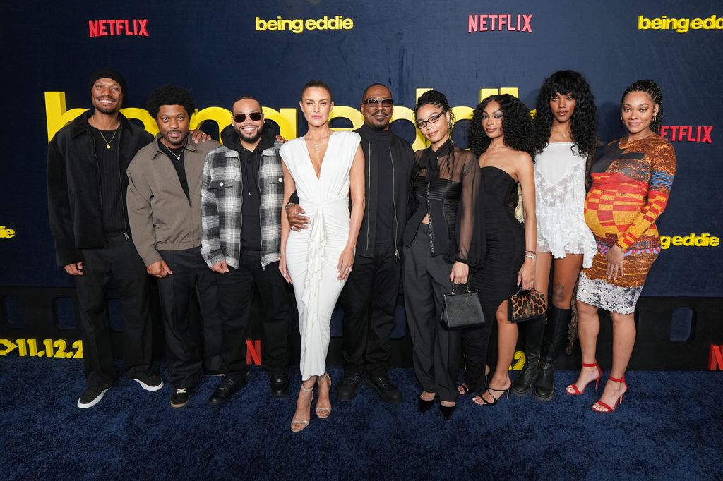 Miles Mitchell Murphy, Christian Murphy, Eric Murphy, Paige Butcher, Eddie Murphy, Bella Murphy, Shayne Audra Murphy, Zola Ivy Murphy, and Bria Murphy Xavier attend Netflix's "Being Eddie" premiere at Netflix Tudum Theater on November 12, 2025 in Los Angeles, California