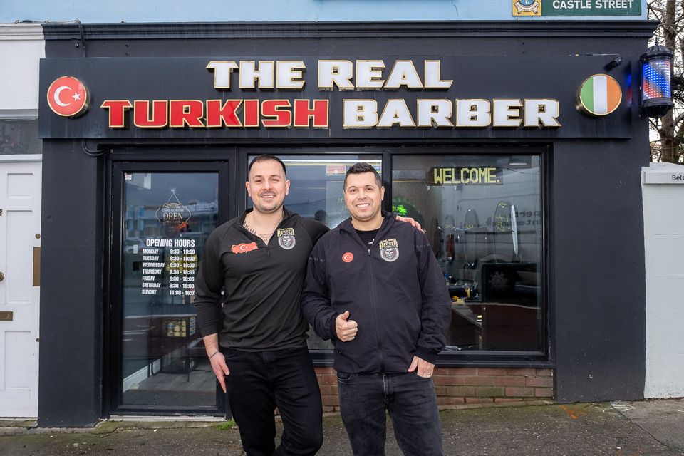 Huseyin Isik and Cavit Uludenizliler outside their shop, the Real Turkish Barber, on Castle Street, Bray. Photo: Leigh Anderson. 