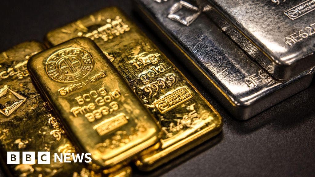 Gold and silver prices fall after Friday's losses - BBC