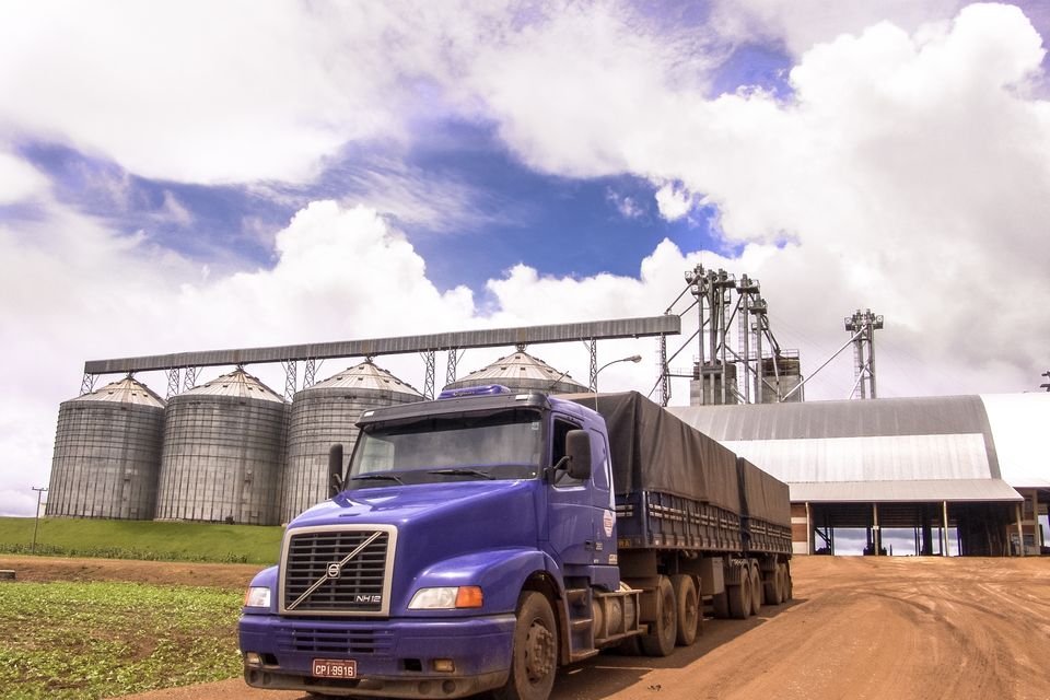 A truck loaded with soybeans leaves a grain storage unit on a farm in Brazil. Photo: Getty